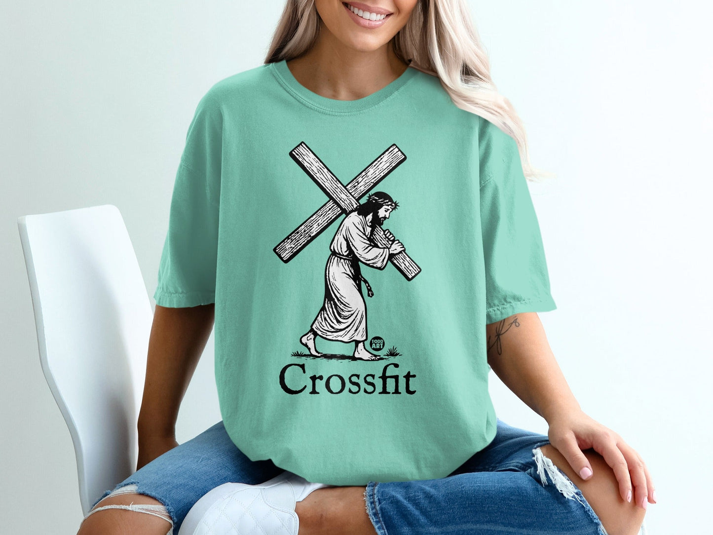 Jesus carrying the cross, text "Crossfit" below.