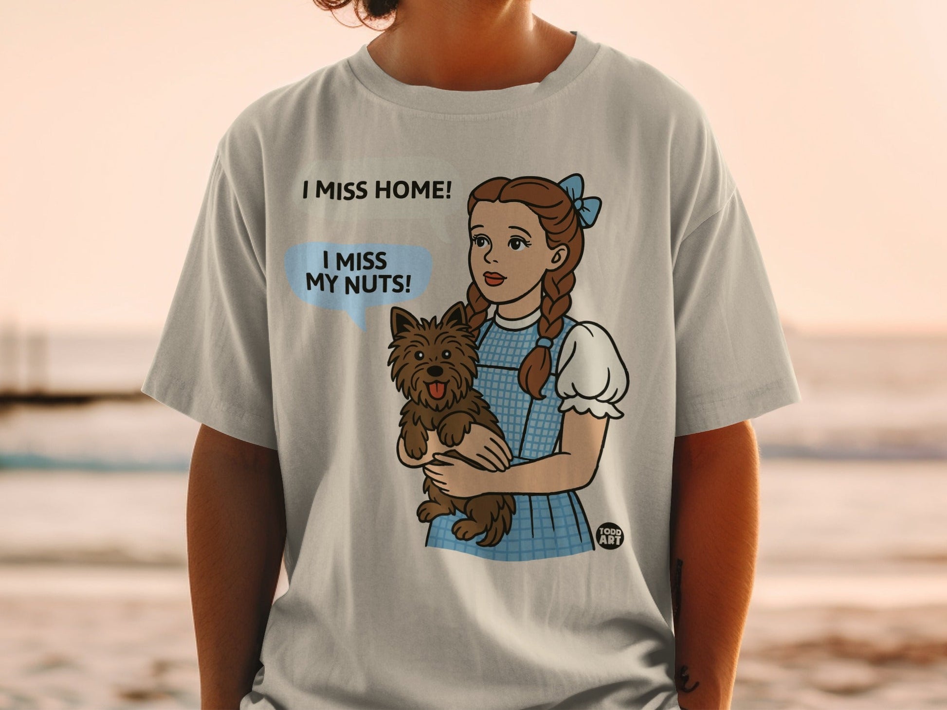 Dorothy from The Wizard of Oz holding Toto and saying "I miss my nuts!"