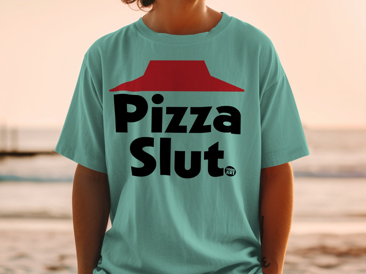 Teal t-shirt with "Pizza Slut" and a red Pizza Hut-like hat logo.