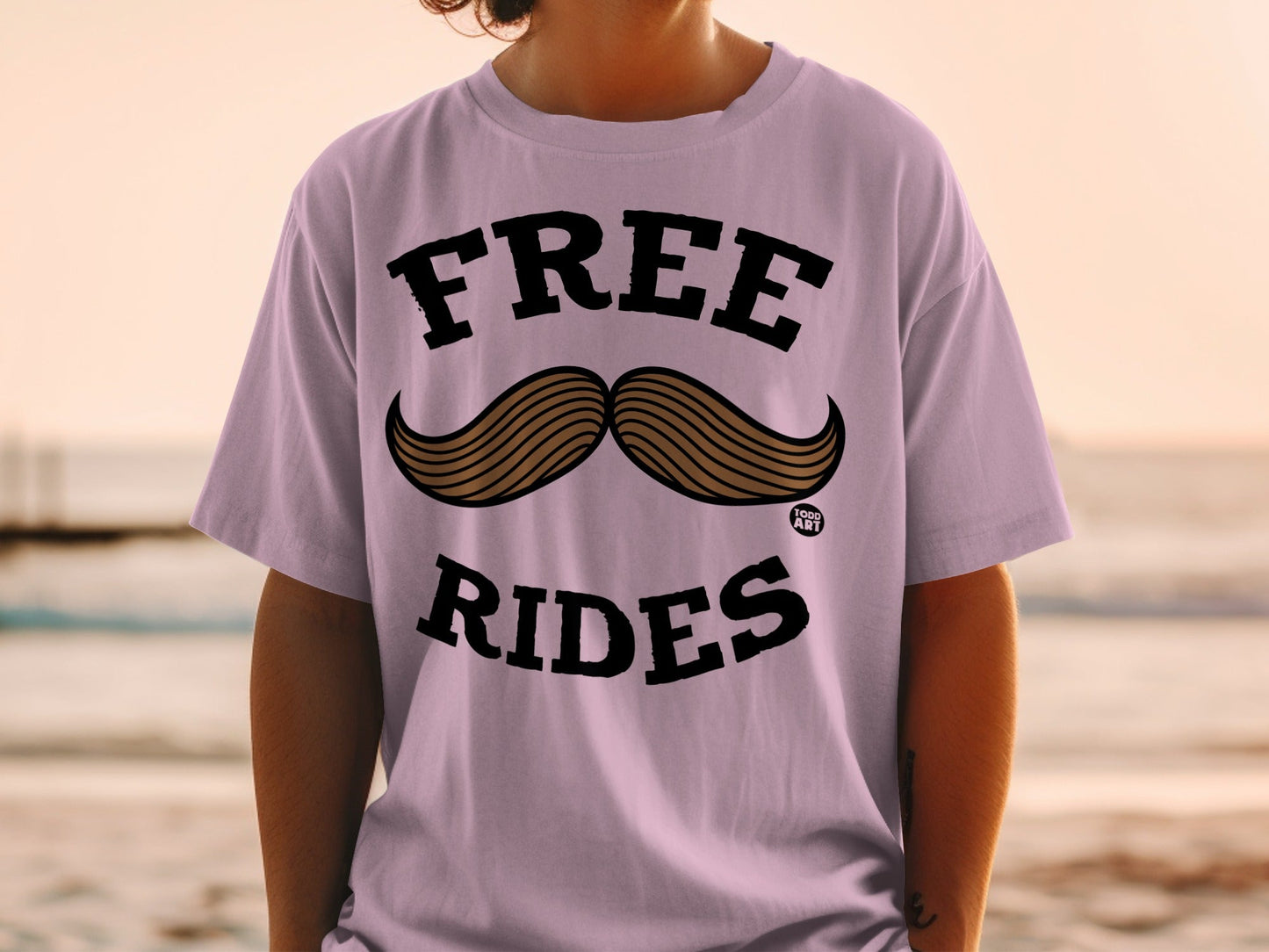 Purple t-shirt with "FREE RIDES" and mustache graphic.