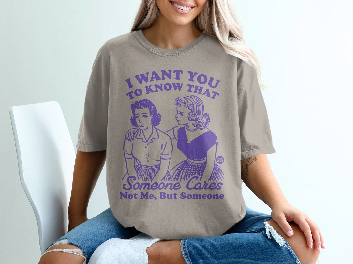 T-shirt with purple graphic "I want you to know that someone cares"