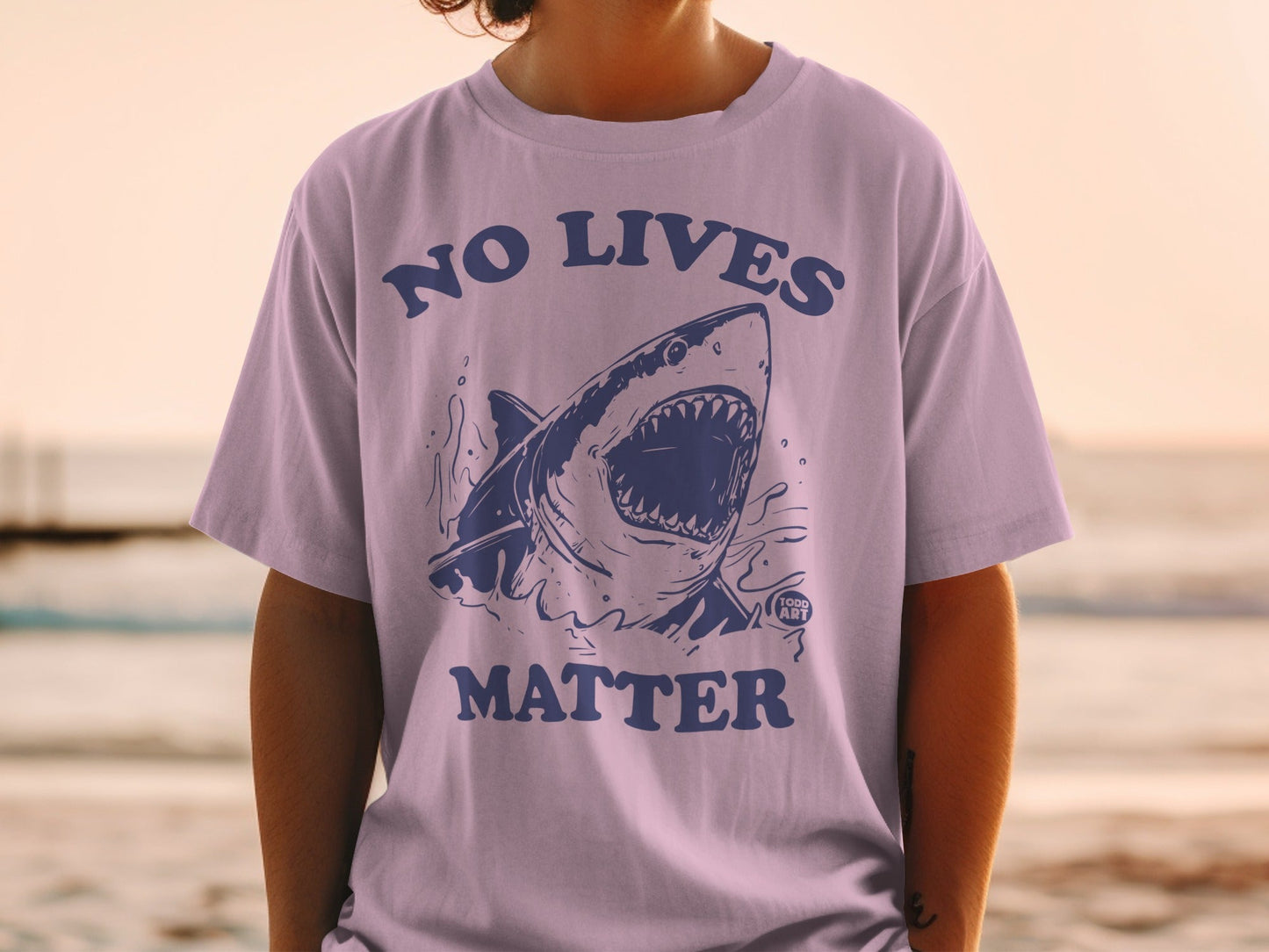 T-shirt with a blue shark illustration and "No Lives Matter" text.