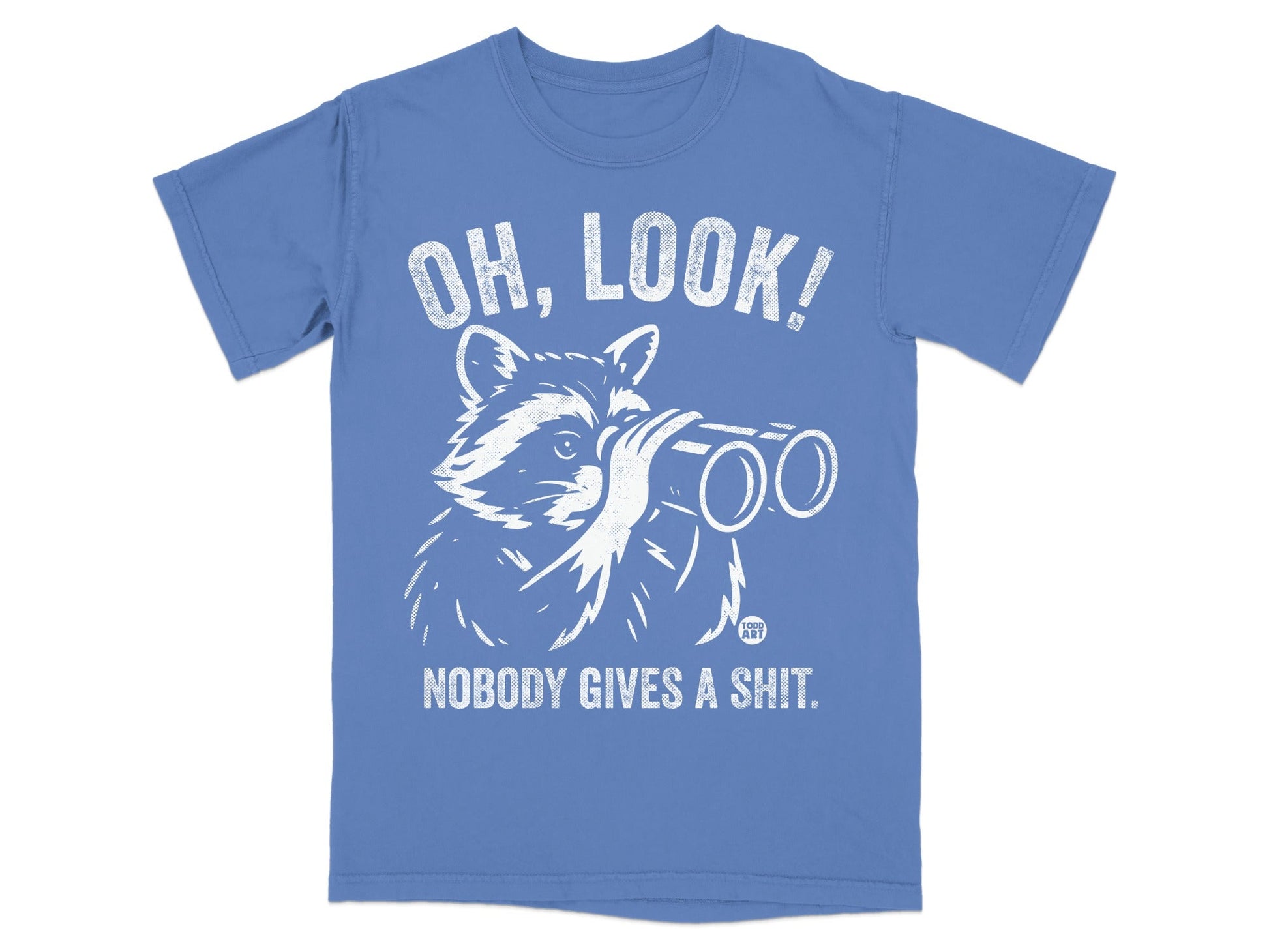 Blue t-shirt with white graphic of raccoon wearing binoculars, text reads "OH, LOOK! NOBODY GIVES A SHIT."