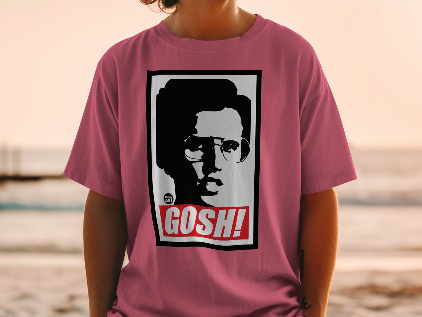 Pink t-shirt with a black and white portrait and "GOSH!" text.