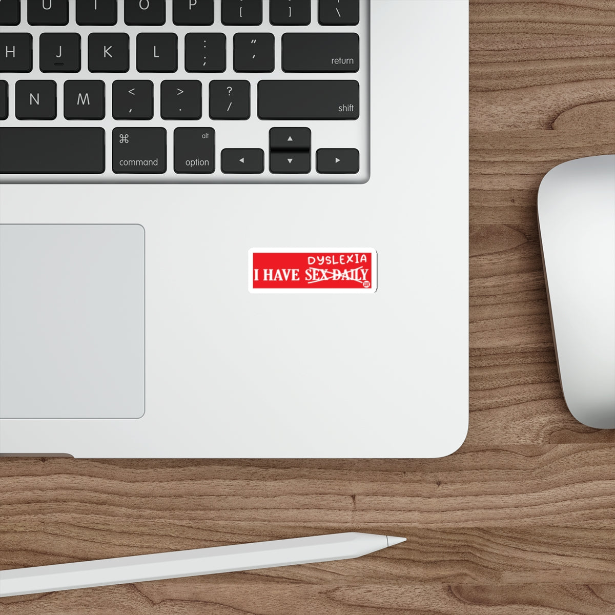 Red sticker on laptop reads "DYSLEXIA I HAVE SEX DAILY".