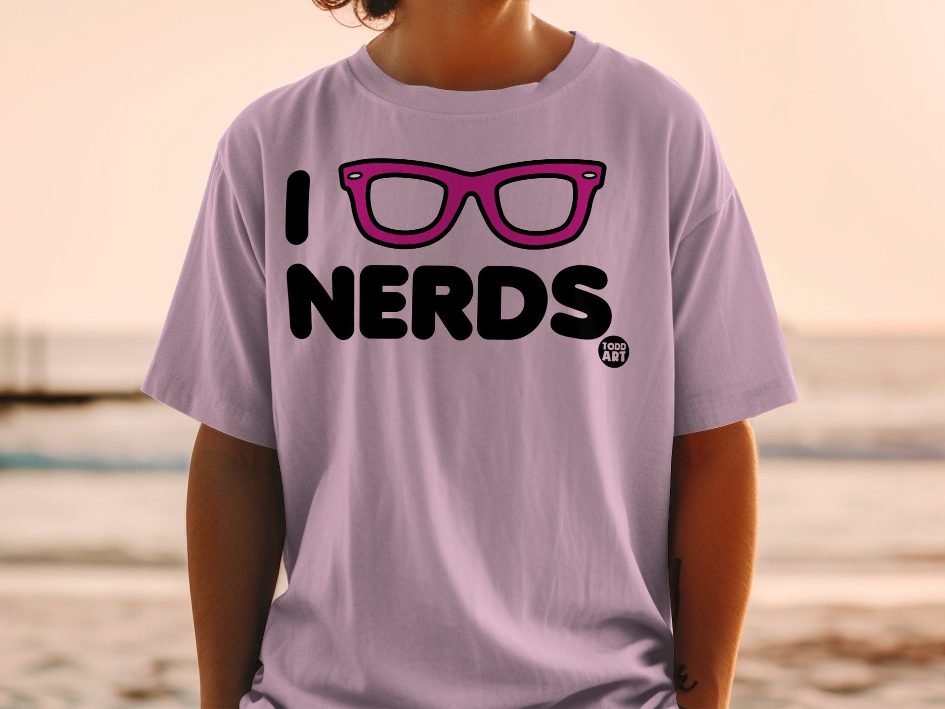 Purple t-shirt with "I Love Nerds" and pink glasses graphic.