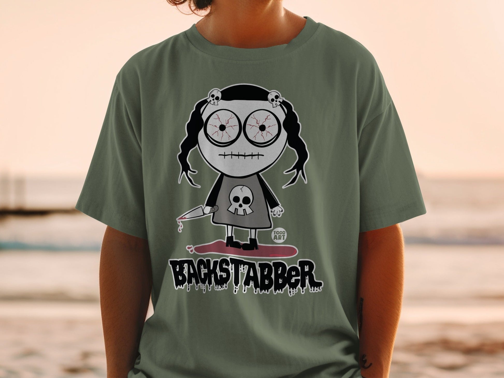 Backstabber Todd Art Character Graphic Tee Shirt