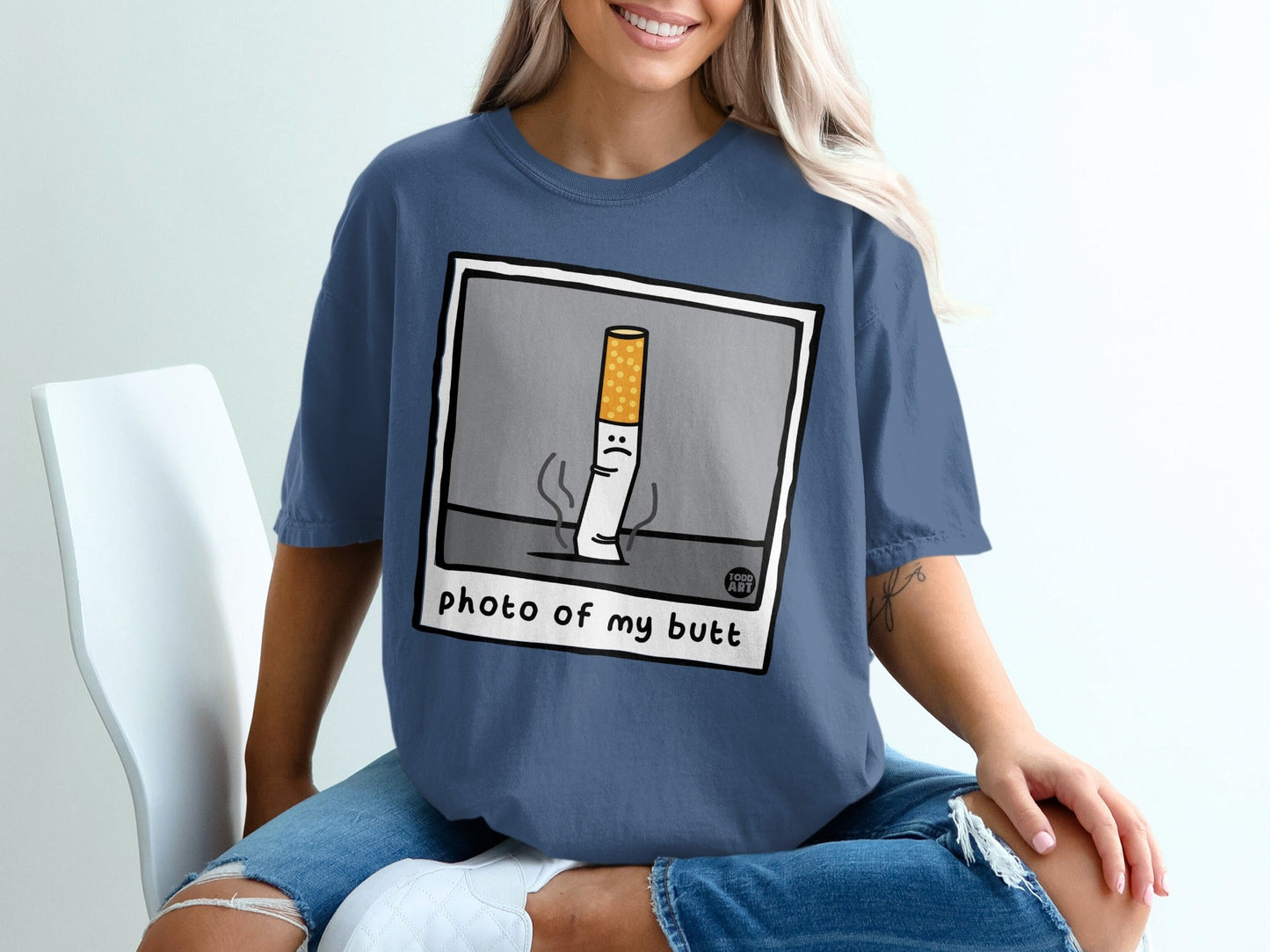 T-shirt with cartoon cigarette saying "photo of my butt."