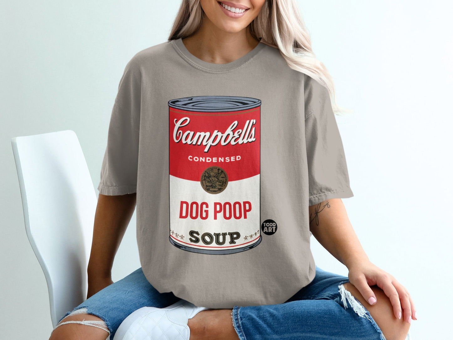 Cream t-shirt with Campbell's Dog Poop Soup can graphic.