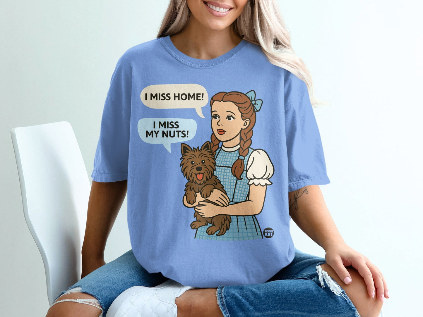 Dorothy holding Toto, speech bubbles say "I miss home!" and "I miss my nuts!".