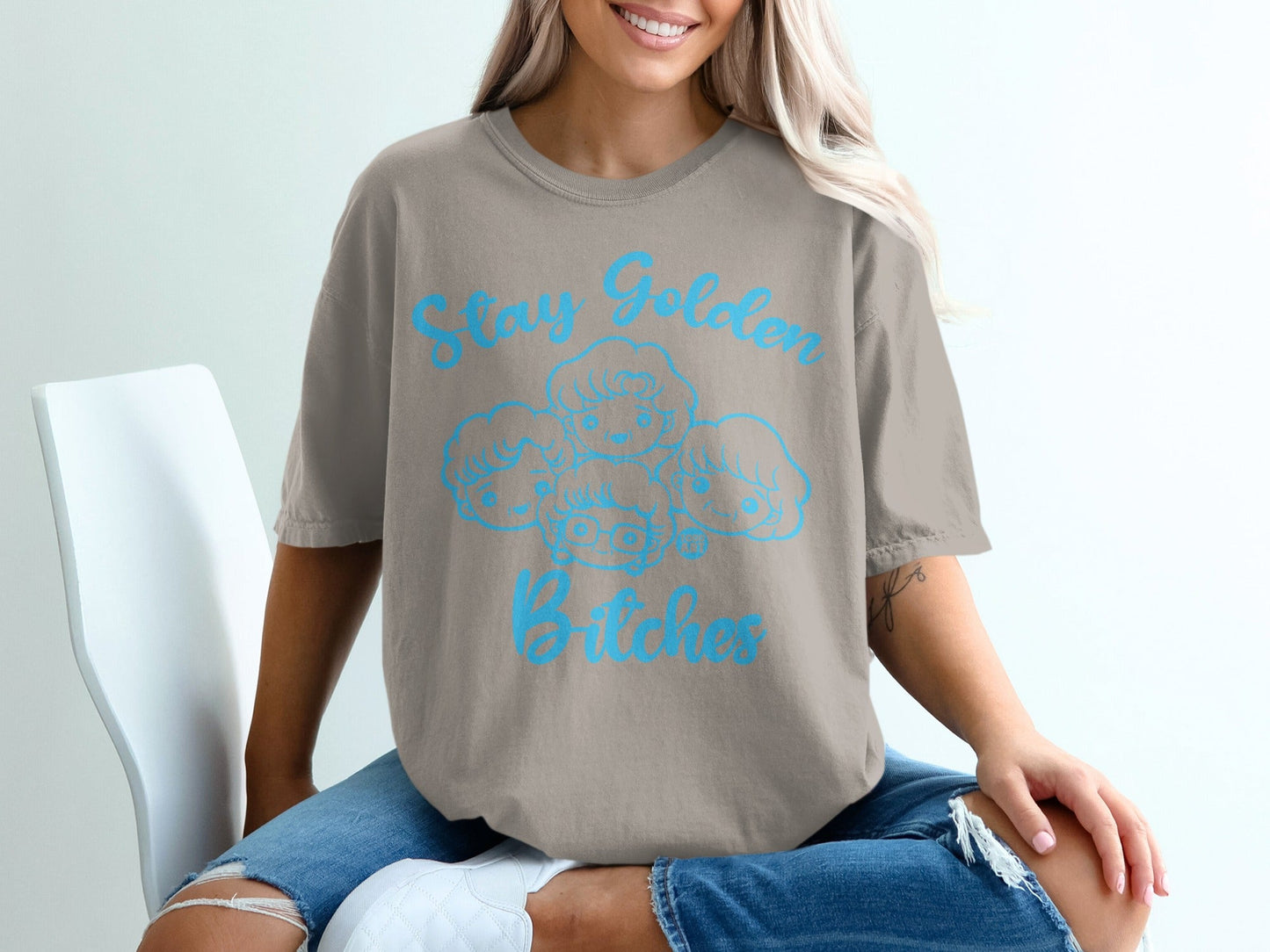 Taupe t-shirt with "Stay Golden Bitches" and cartoon Golden Girls graphic.