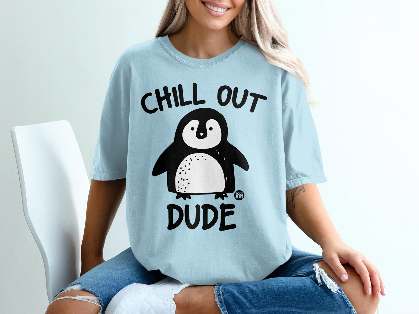 Light blue t-shirt with "Chill Out Dude" and a cartoon penguin graphic.