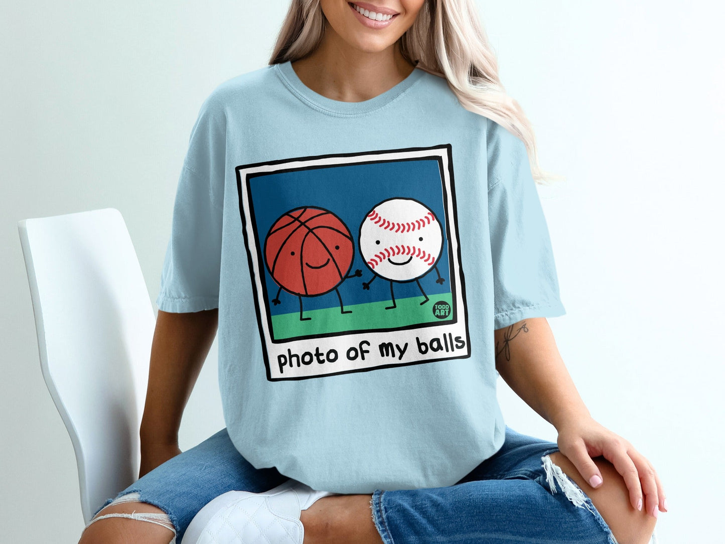 Cartoon basketball and baseball characters with text "photo of my balls".