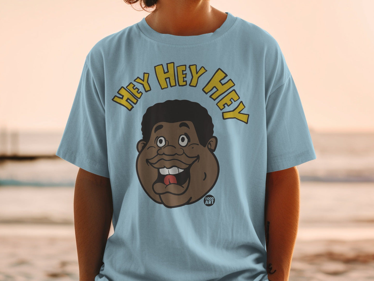 Light blue t-shirt with cartoon face and "HEY HEY HEY" text.