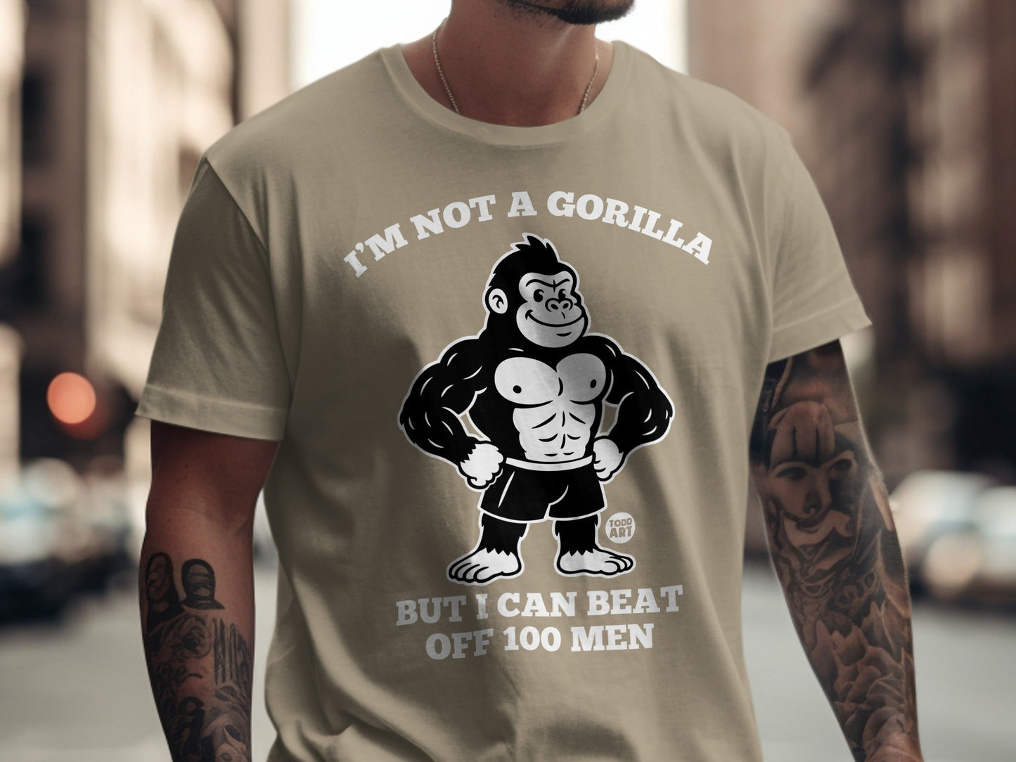 T-shirt with a cartoon gorilla and text "I'M NOT A GORILLA BUT I CAN BEAT OFF 100 MEN".