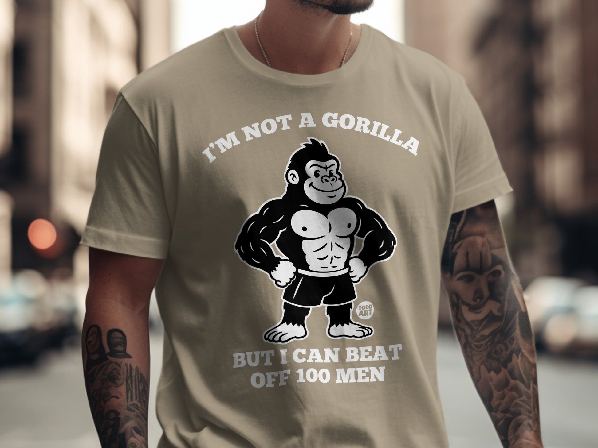 T-shirt with a cartoon gorilla and text "I'M NOT A GORILLA BUT I CAN BEAT OFF 100 MEN".