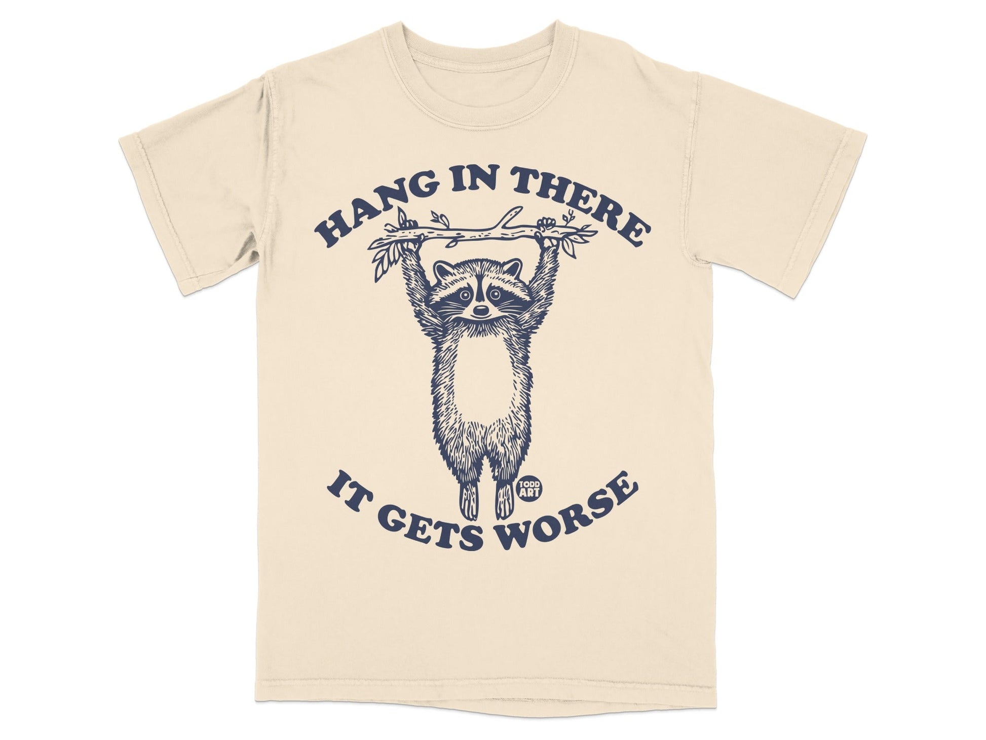 T-shirt with raccoon hanging from branch, text "Hang in there, it gets worse."