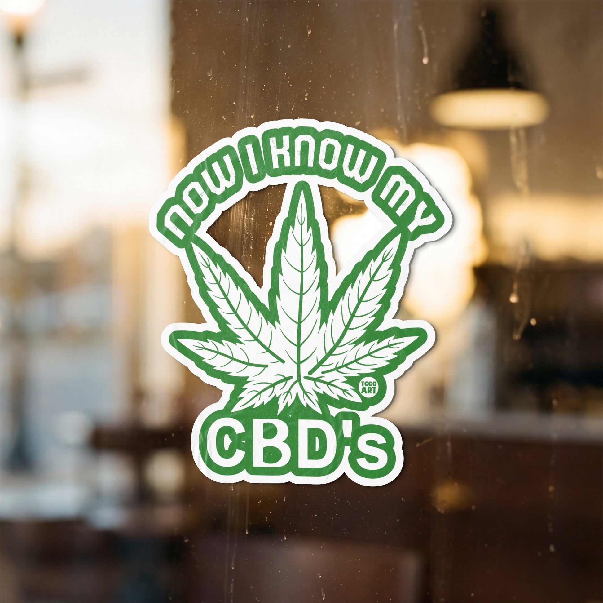 Sticker with green cannabis leaf and text "NOW I KNOW MY CBD'S" and "TODD ART".