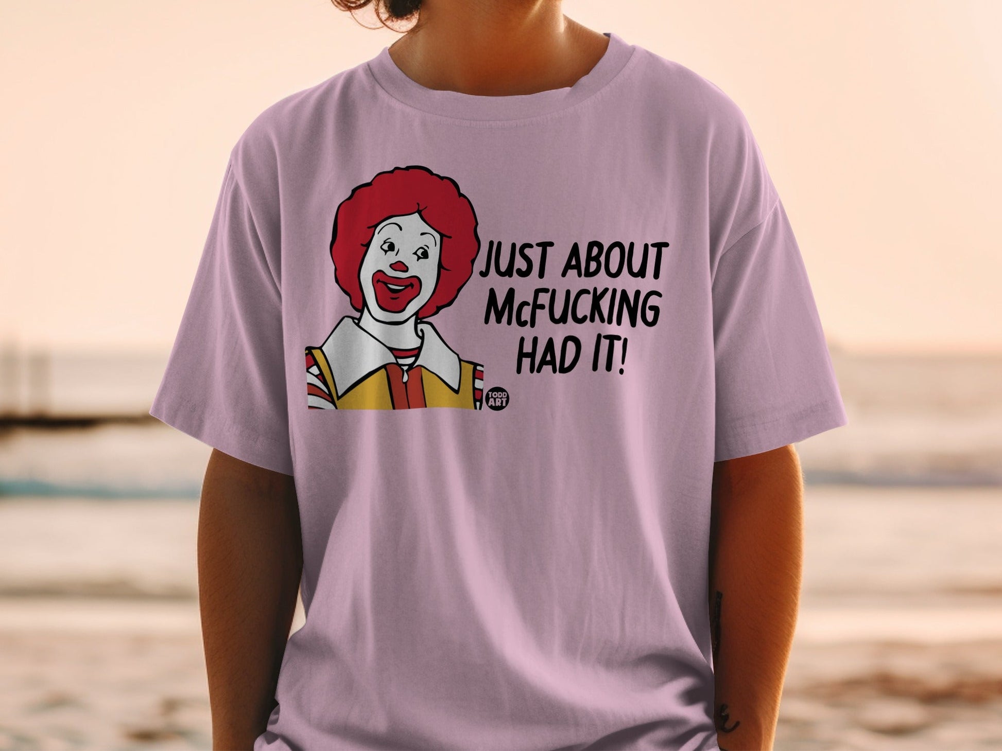 Ronald McDonald graphic on light purple t-shirt with text "JUST ABOUT MCFUCKING HAD IT!".
