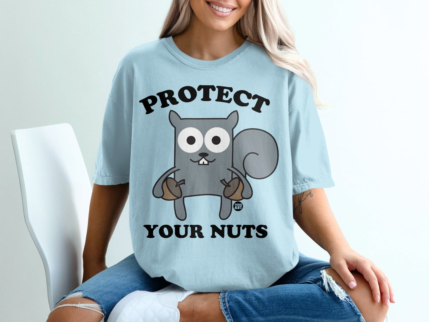 Light blue t-shirt with "PROTECT YOUR NUTS" and a cartoon squirrel.