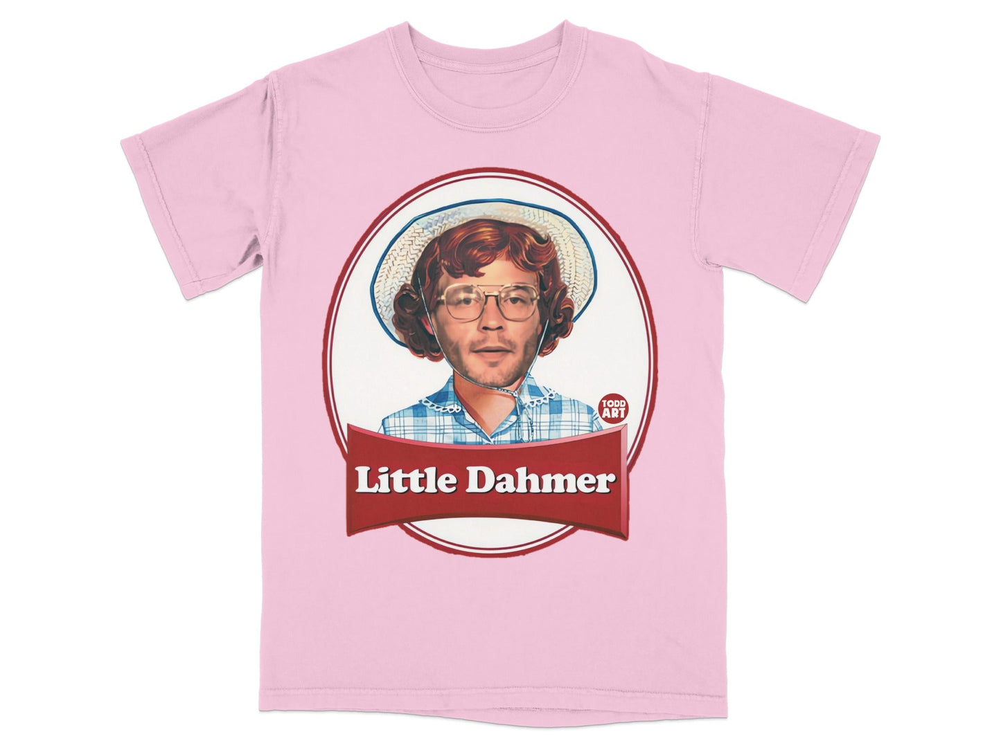Pink t-shirt with a framed graphic of a person wearing glasses and a hat.