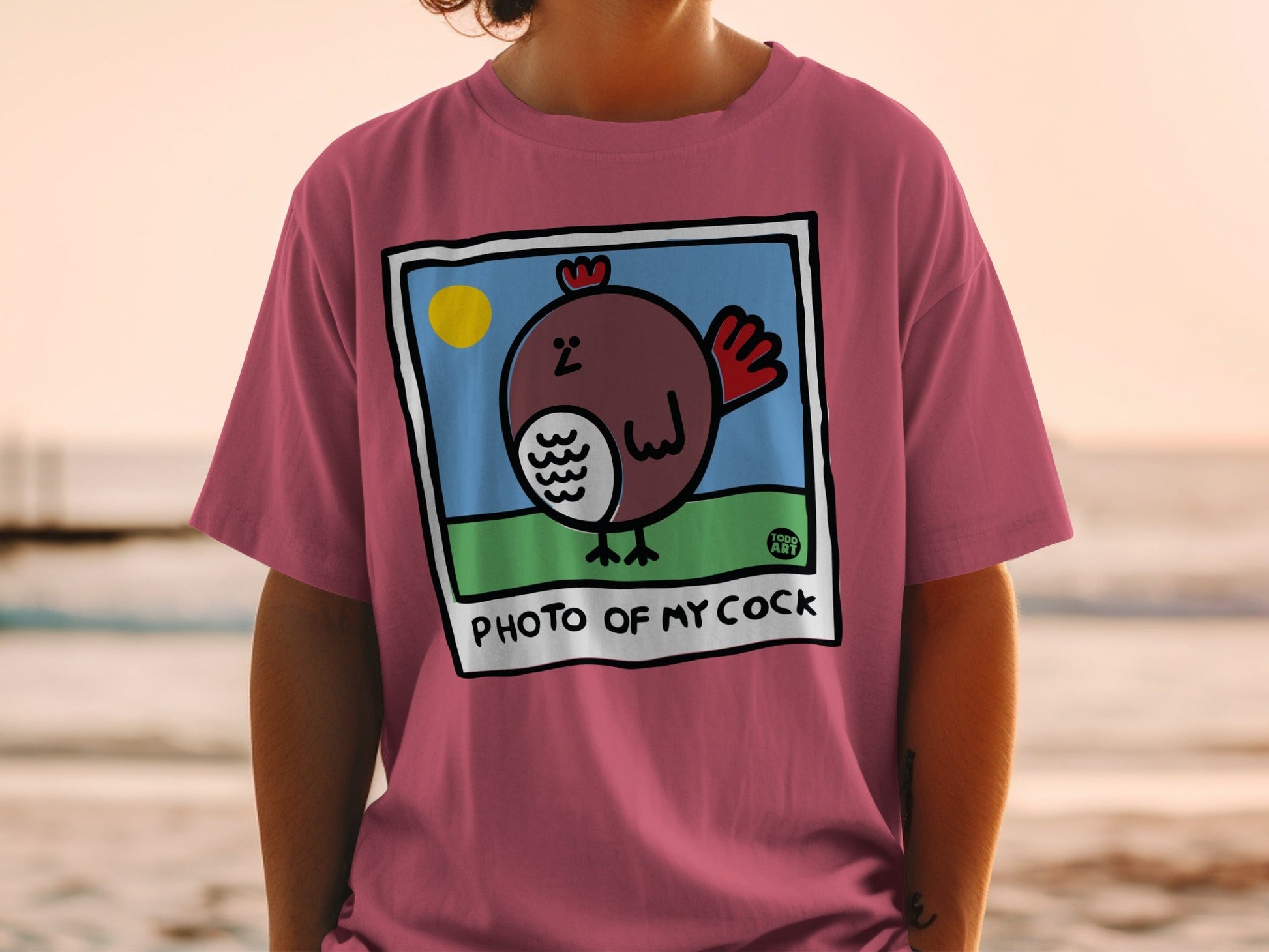 T-shirt with cartoon chicken illustration and text "PHOTO OF MY COCK".
