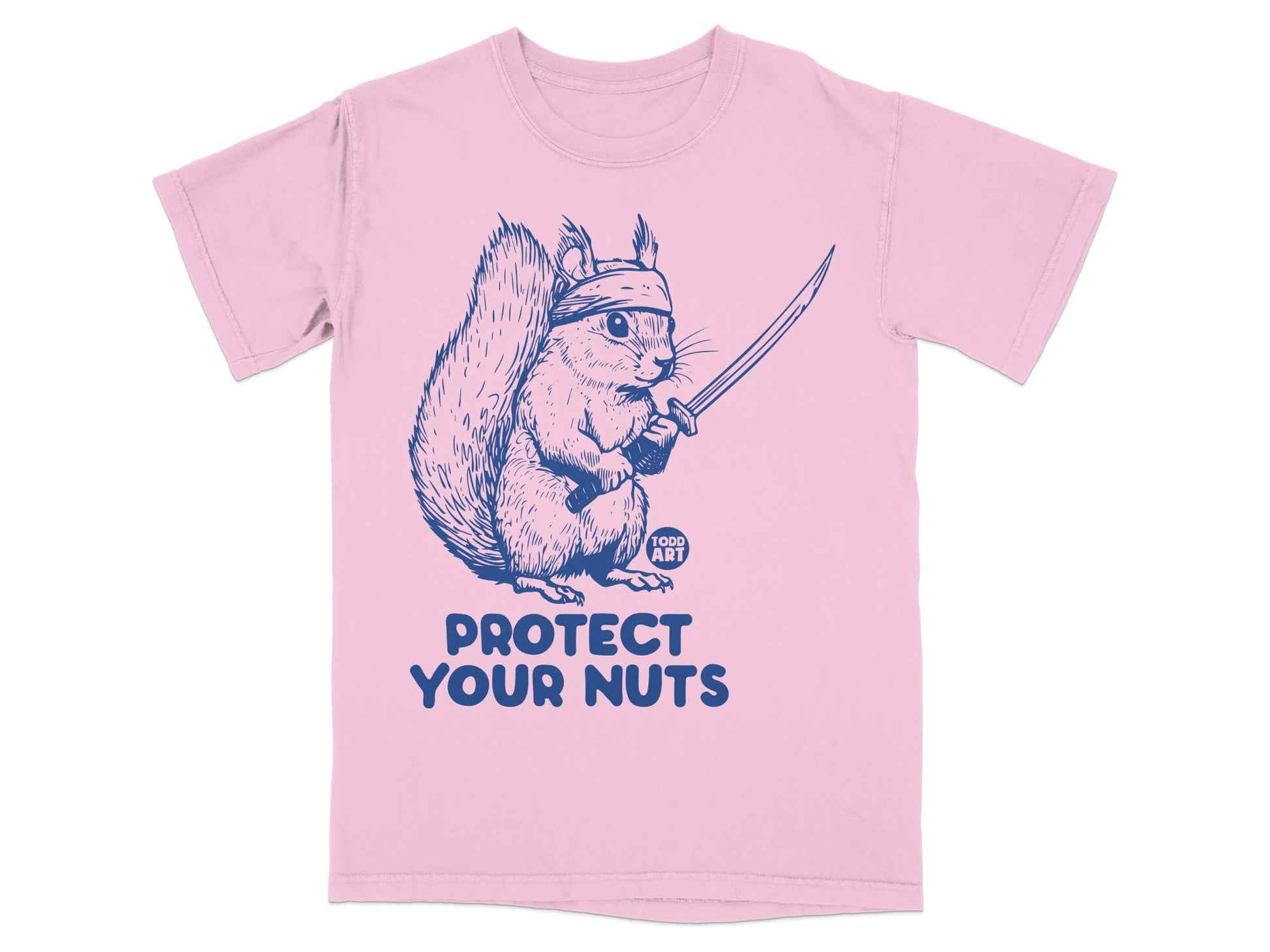 Pink t-shirt with a blue graphic of a squirrel in a bandana wielding a sword, text reads "PROTECT YOUR NUTS".