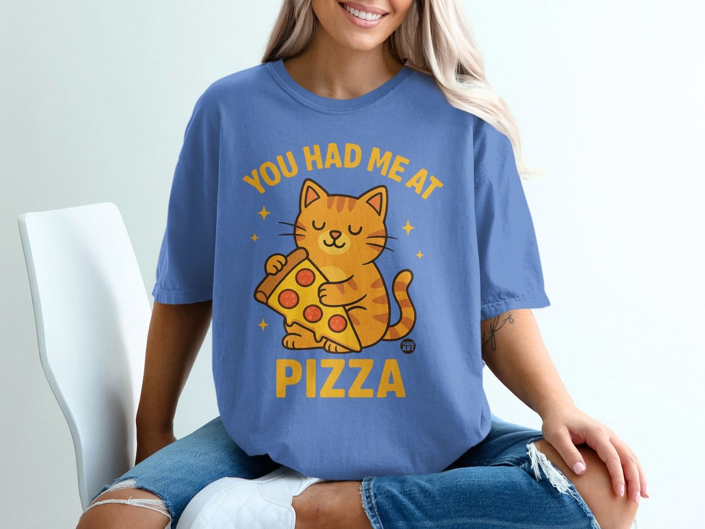 Blue t-shirt with "You had me at Pizza" and a cartoon cat holding pizza.