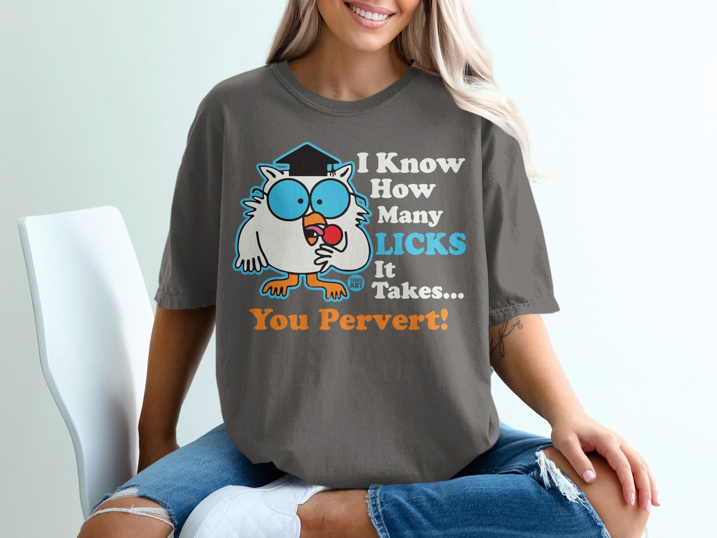 Dark gray t-shirt with cartoon owl wearing graduation cap saying "I Know How Many Licks It Takes... You Pervert!"