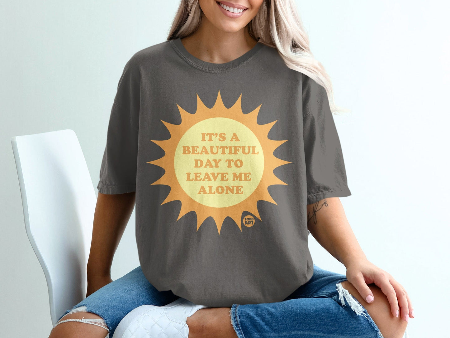 Dark grey t-shirt with sun graphic and text "It's a beautiful day to leave me alone."