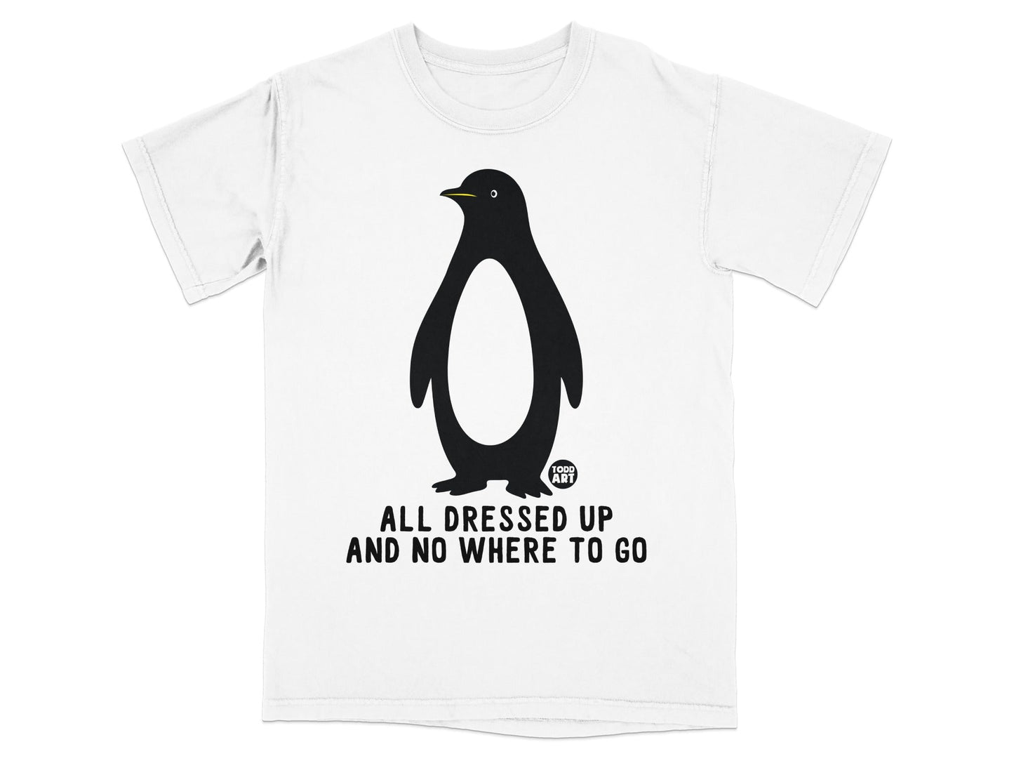 White t-shirt with a black penguin graphic and text "ALL DRESSED UP AND NO WHERE TO GO".