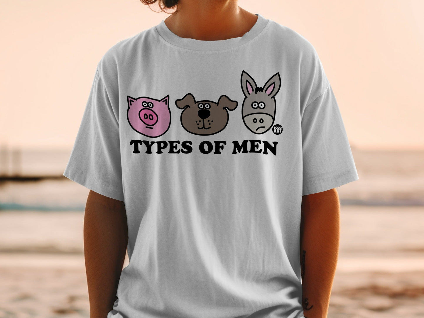 T-shirt with cartoon pig, dog, and donkey faces and text "TYPES OF MEN".