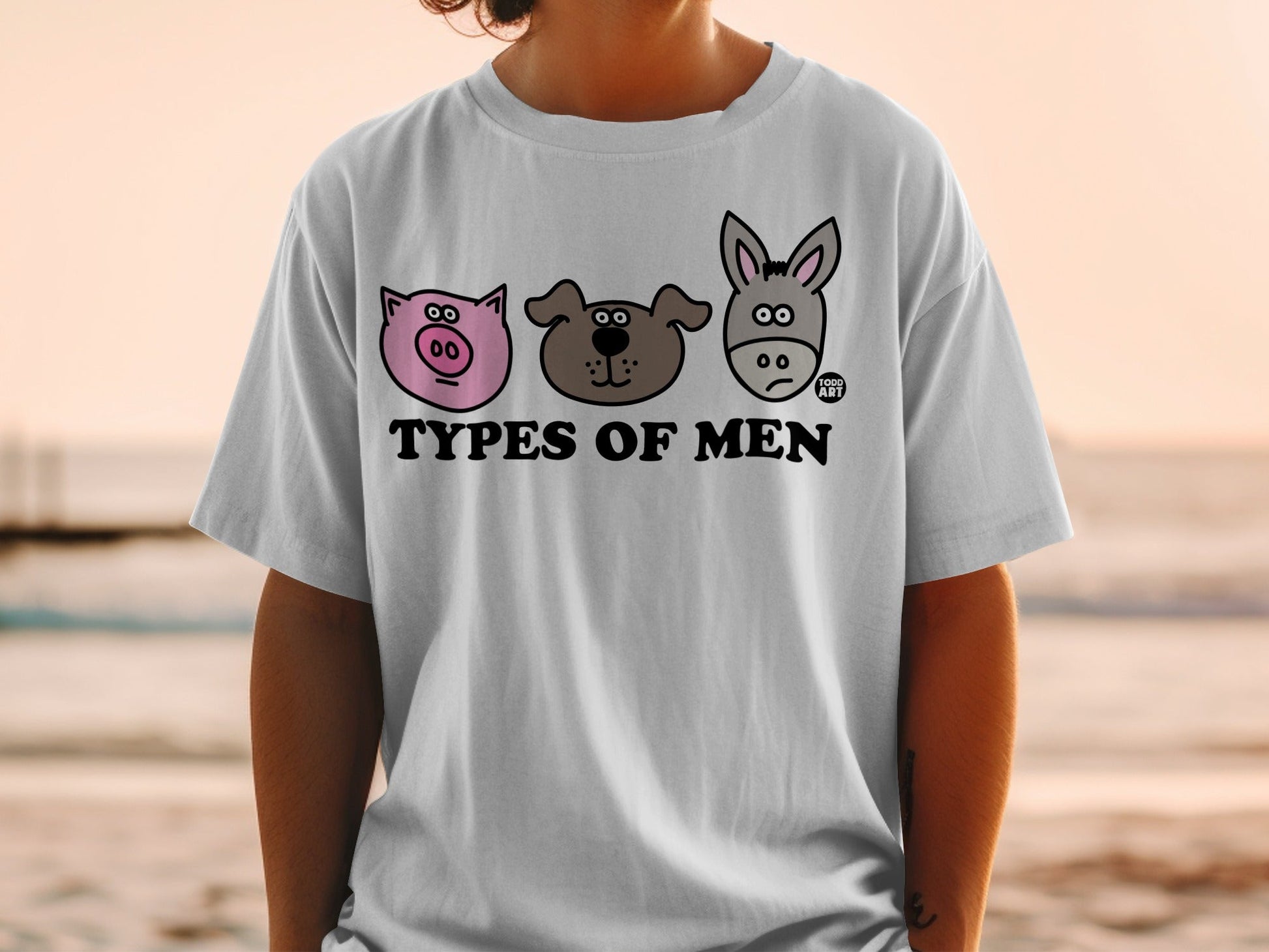 T-shirt with cartoon pig, dog, and donkey faces and text "TYPES OF MEN".