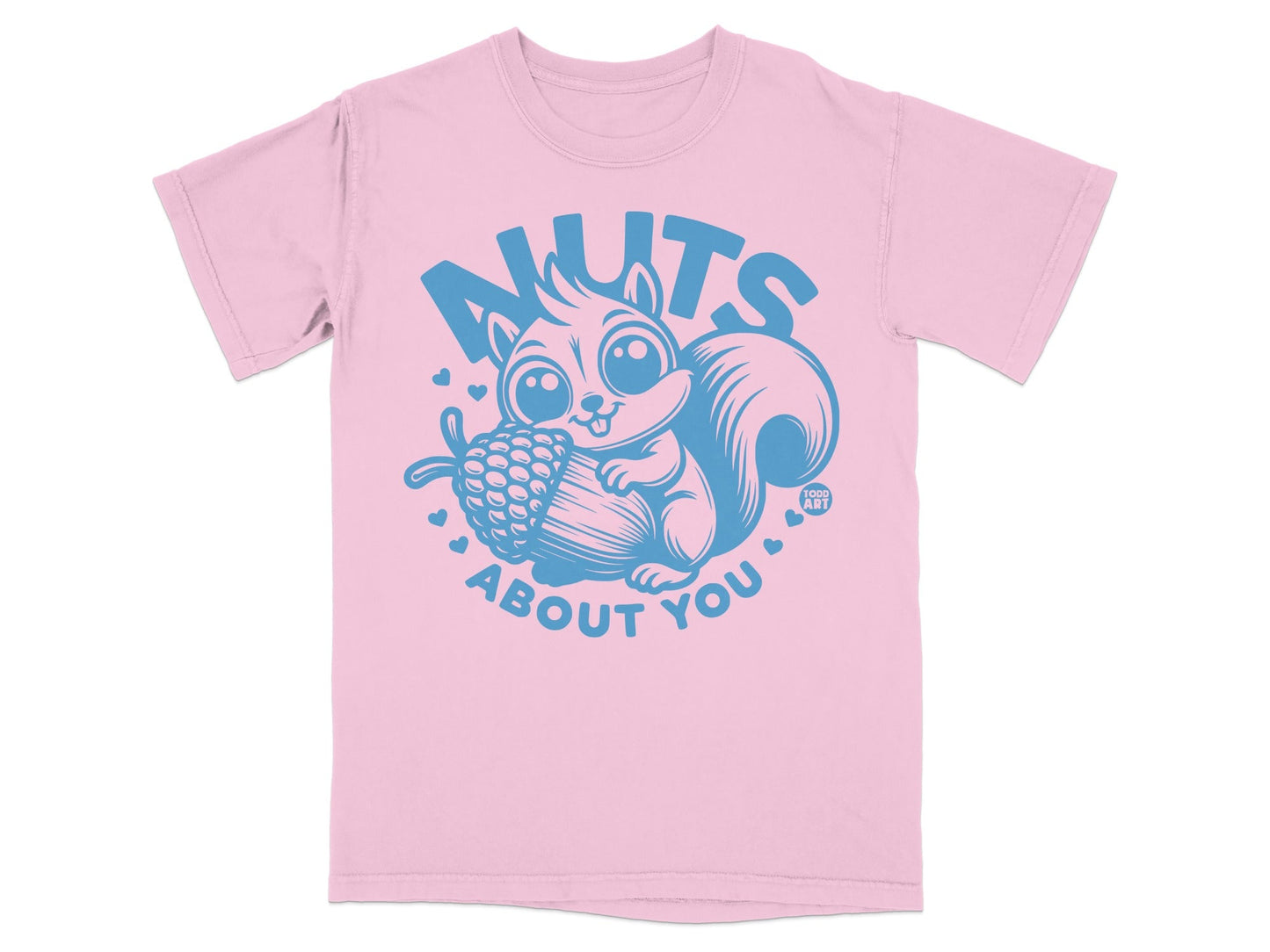 Pink t-shirt with cartoon squirrel holding acorn and "NUTS ABOUT YOU" text.