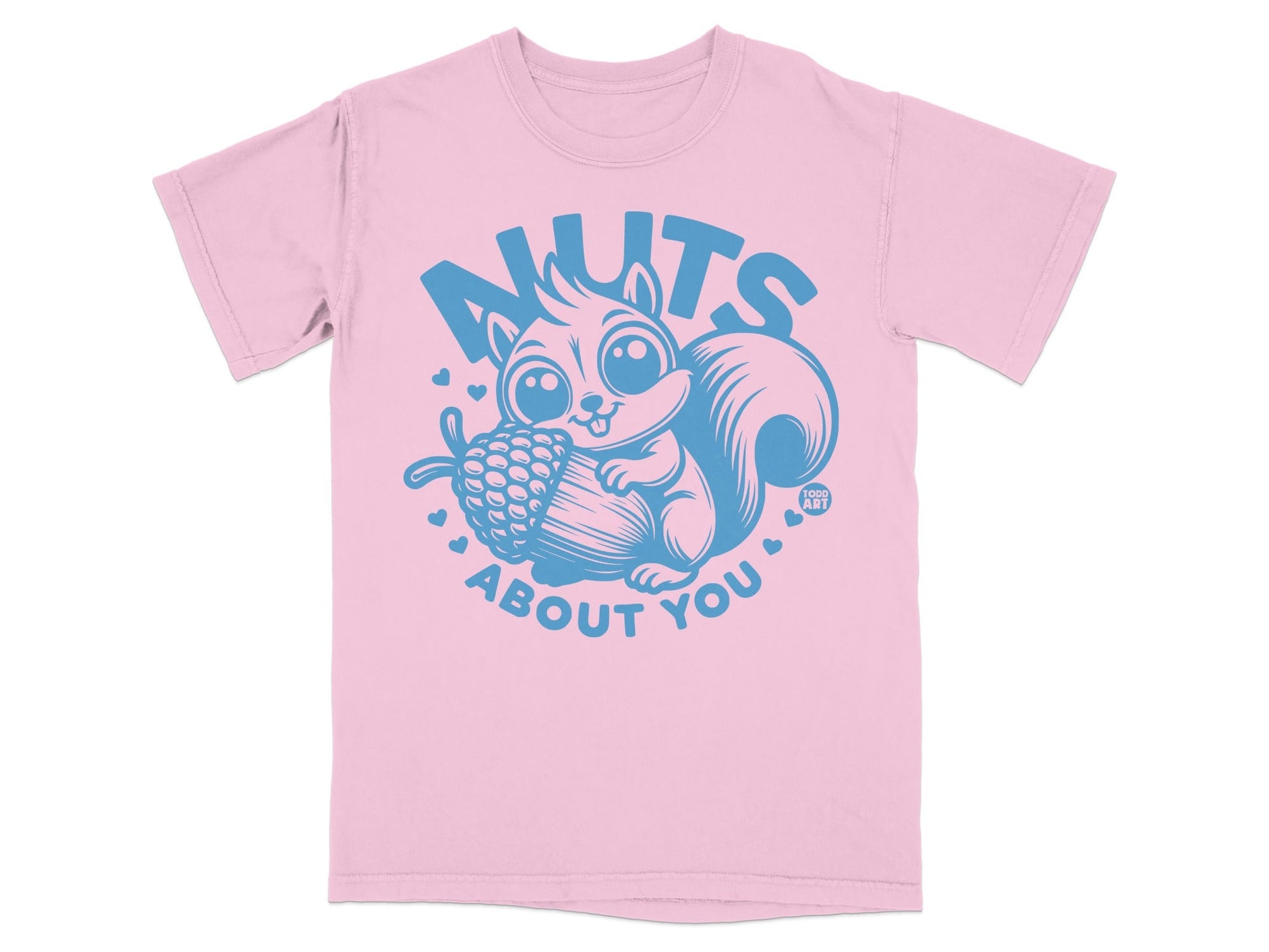 Pink t-shirt with cartoon squirrel holding acorn and "NUTS ABOUT YOU" text.