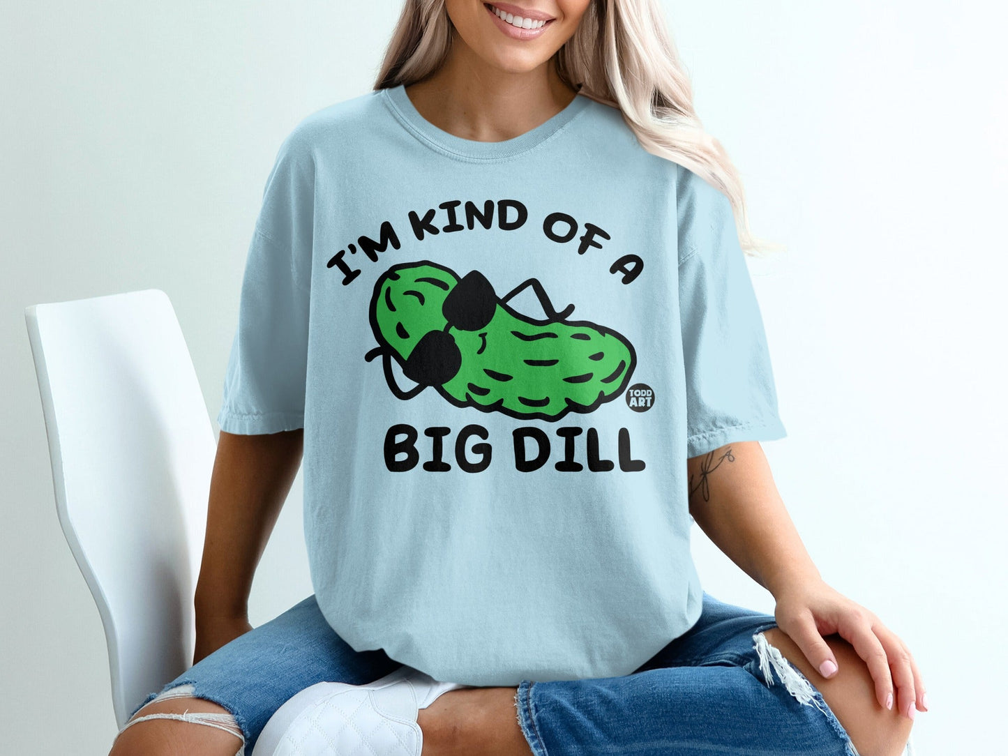Light blue t-shirt with a cartoon pickle wearing sunglasses, saying "I'm kind of a big dill".
