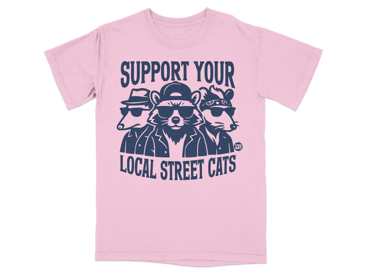 Three cartoon raccoons wearing sunglasses and hats on a pink t-shirt.