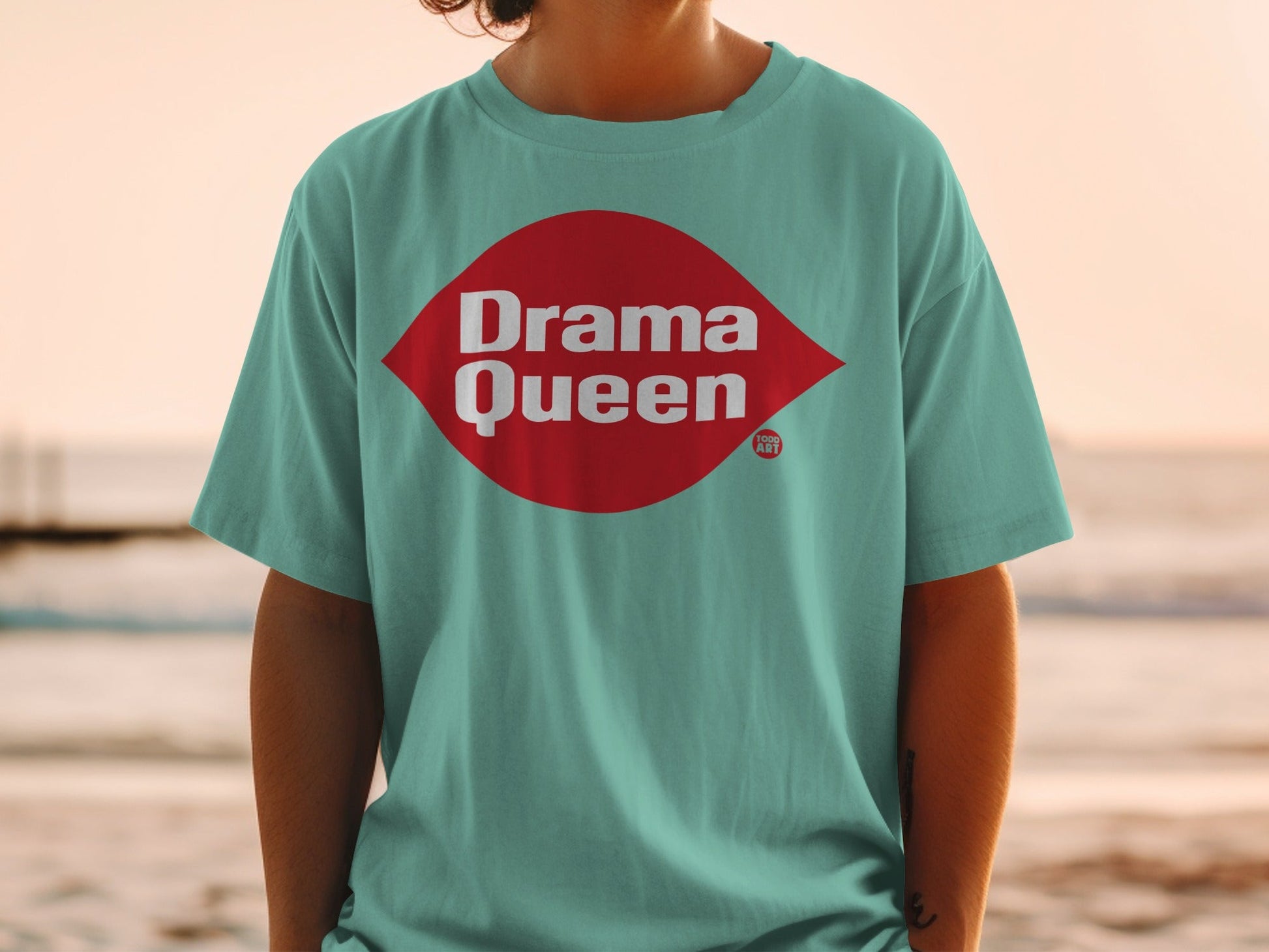 Teal t-shirt with red "Drama Queen" graphic on chest.