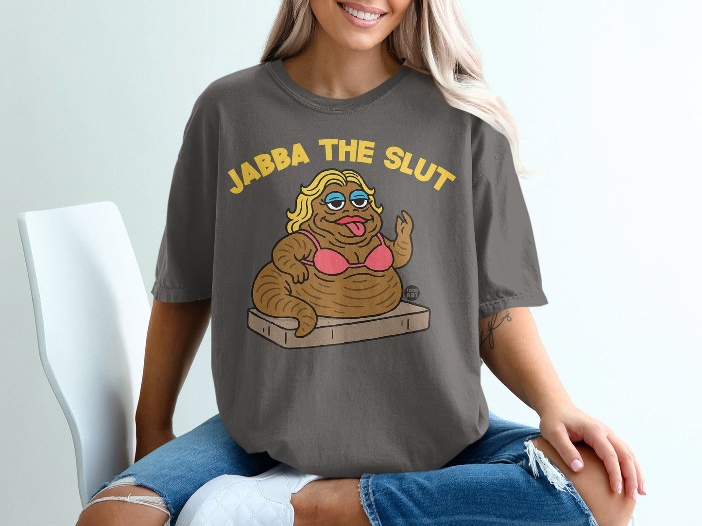 T-shirt with cartoon Jabba the Hutt wearing a bikini and text "JABBA THE SLUT".