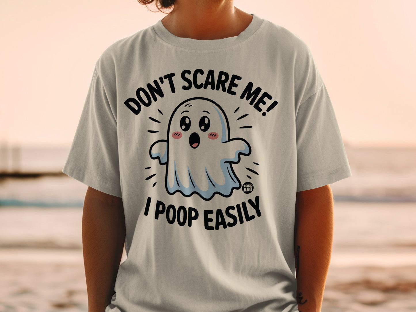 T-shirt with a cartoon ghost saying "Don't Scare Me! I Poop Easily."