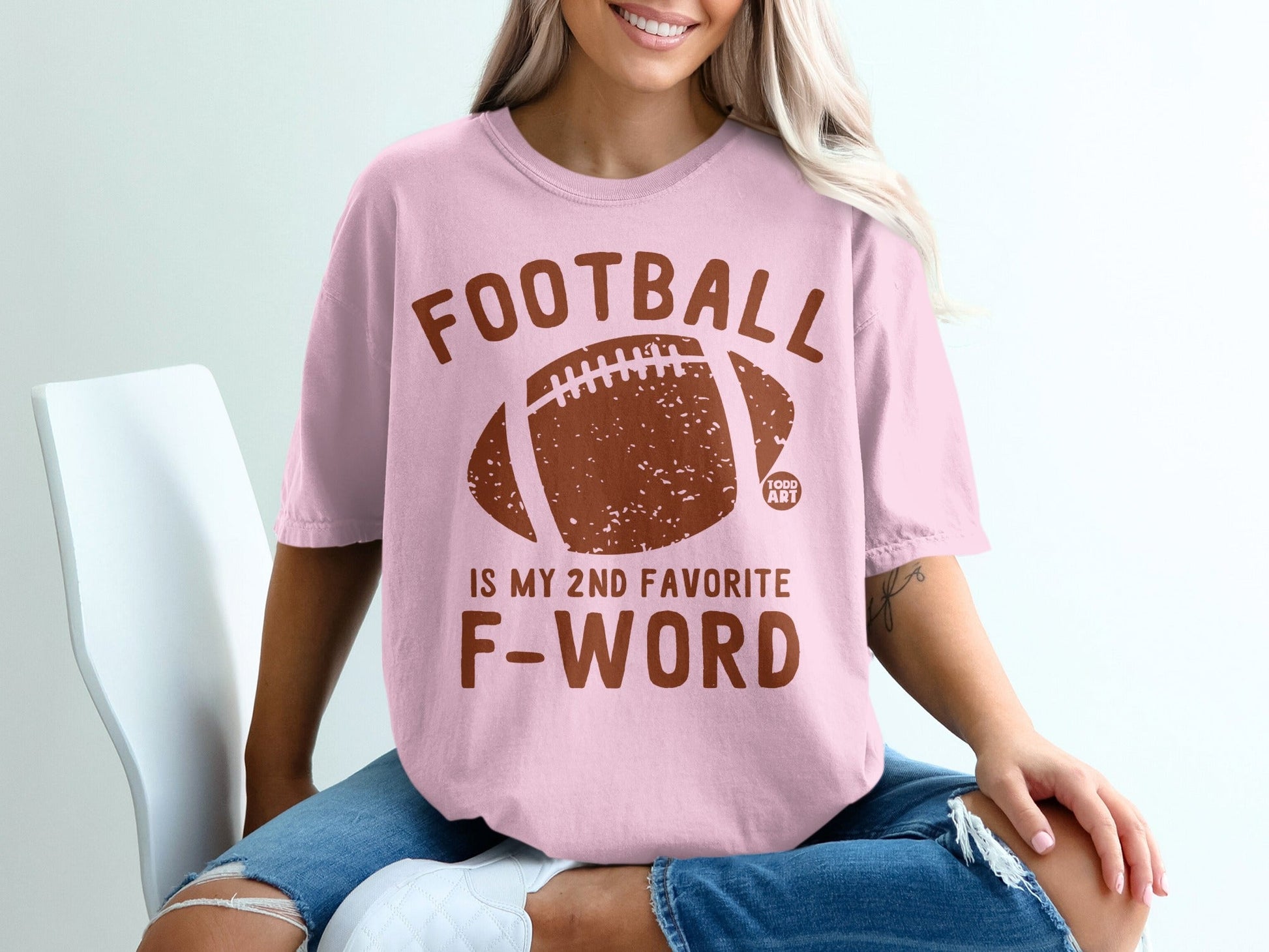 Pink t-shirt with "FOOTBALL IS MY 2ND FAVORITE F-WORD" and a football graphic.