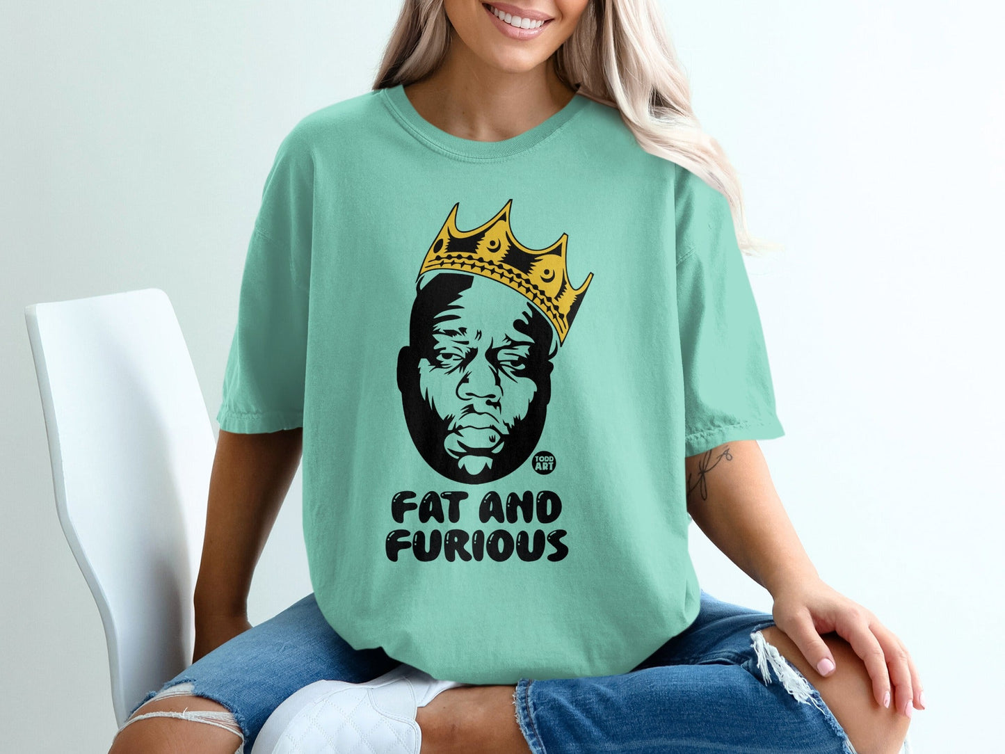 T-shirt with a portrait of a man wearing a crown, text reads "FAT AND FURIOUS".