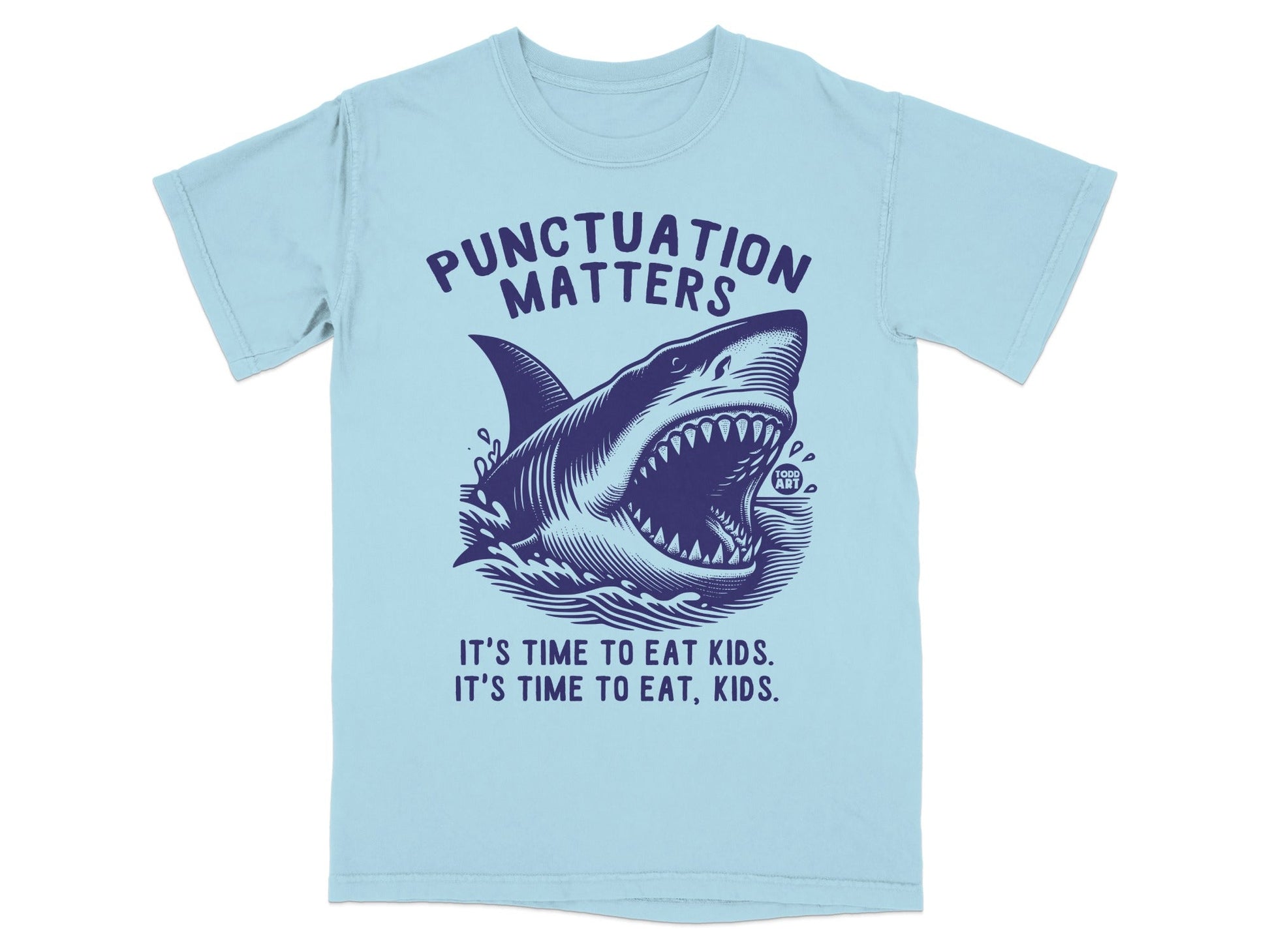 Light blue t-shirt with a dark blue shark and text "Punctuation Matters" and "It's Time to Eat Kids. It's Time to Eat, Kids."