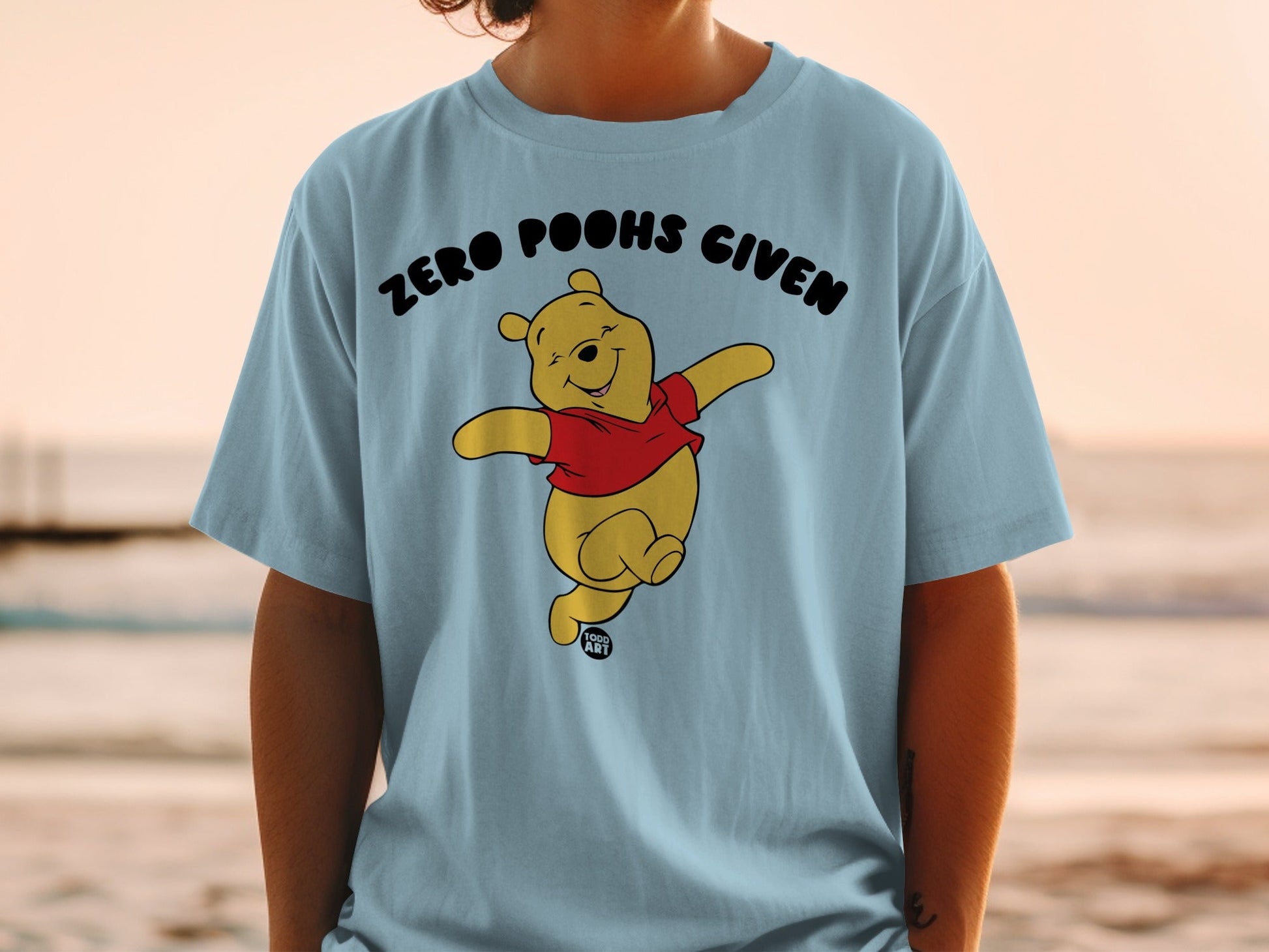 Winnie the Pooh wearing a red shirt, text "ZERO POOHS GIVEN".