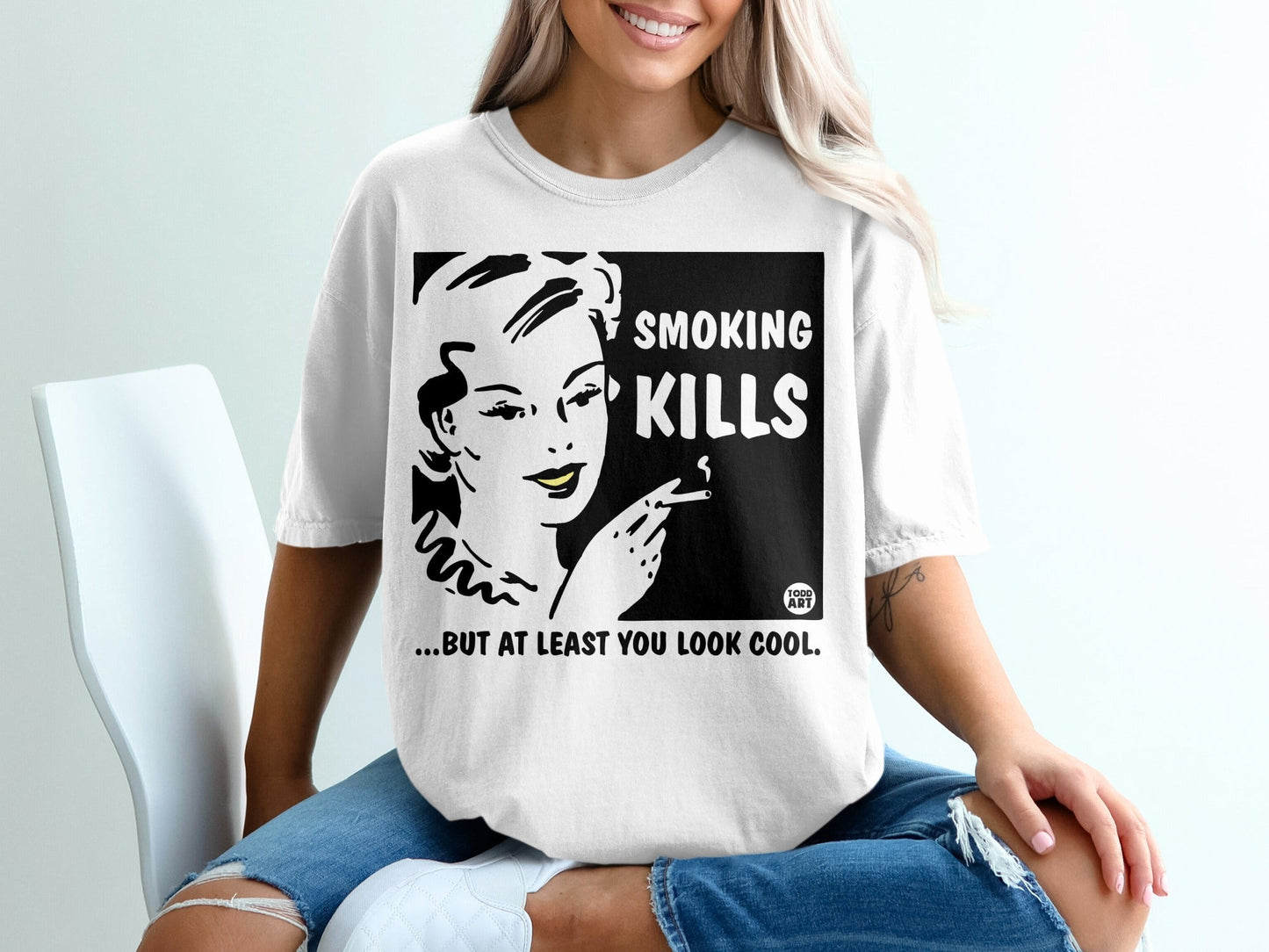 White t-shirt with "SMOKING KILLS...BUT AT LEAST YOU LOOK COOL" graphic.