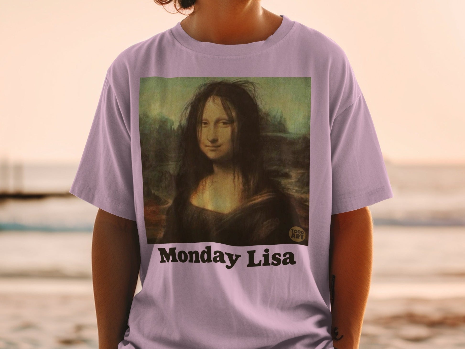 T-shirt with "Monday Lisa" text and Mona Lisa painting.