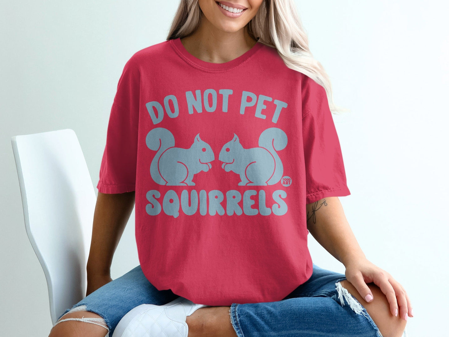 Red t-shirt with "DO NOT PET SQUIRRELS" and squirrel graphic.