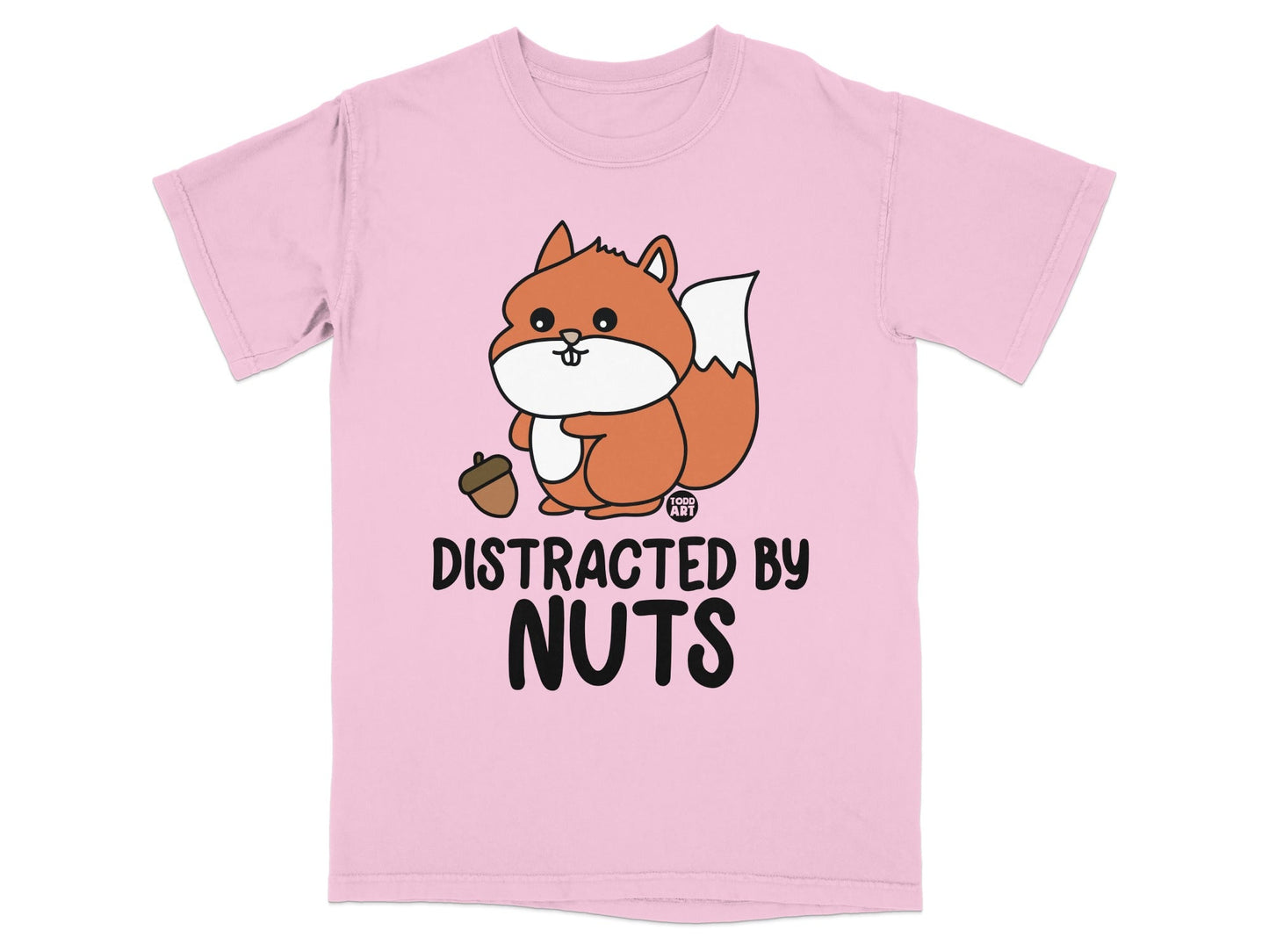 Pink t-shirt with a cartoon squirrel holding an acorn and the text "DISTRACTED BY NUTS".