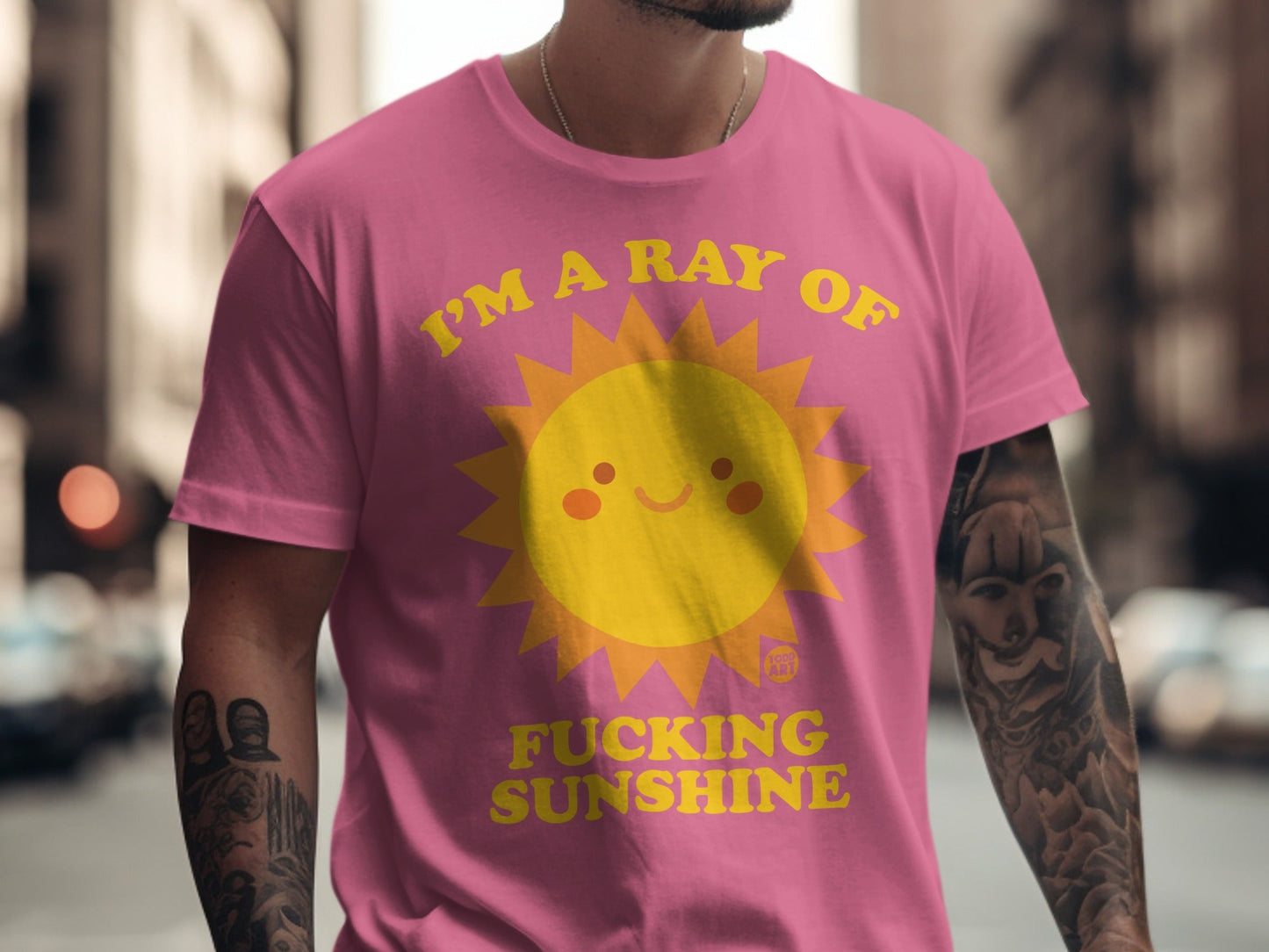 Pink t-shirt with a yellow sun graphic and "I'M A RAY OF FUCKING SUNSHINE" text.