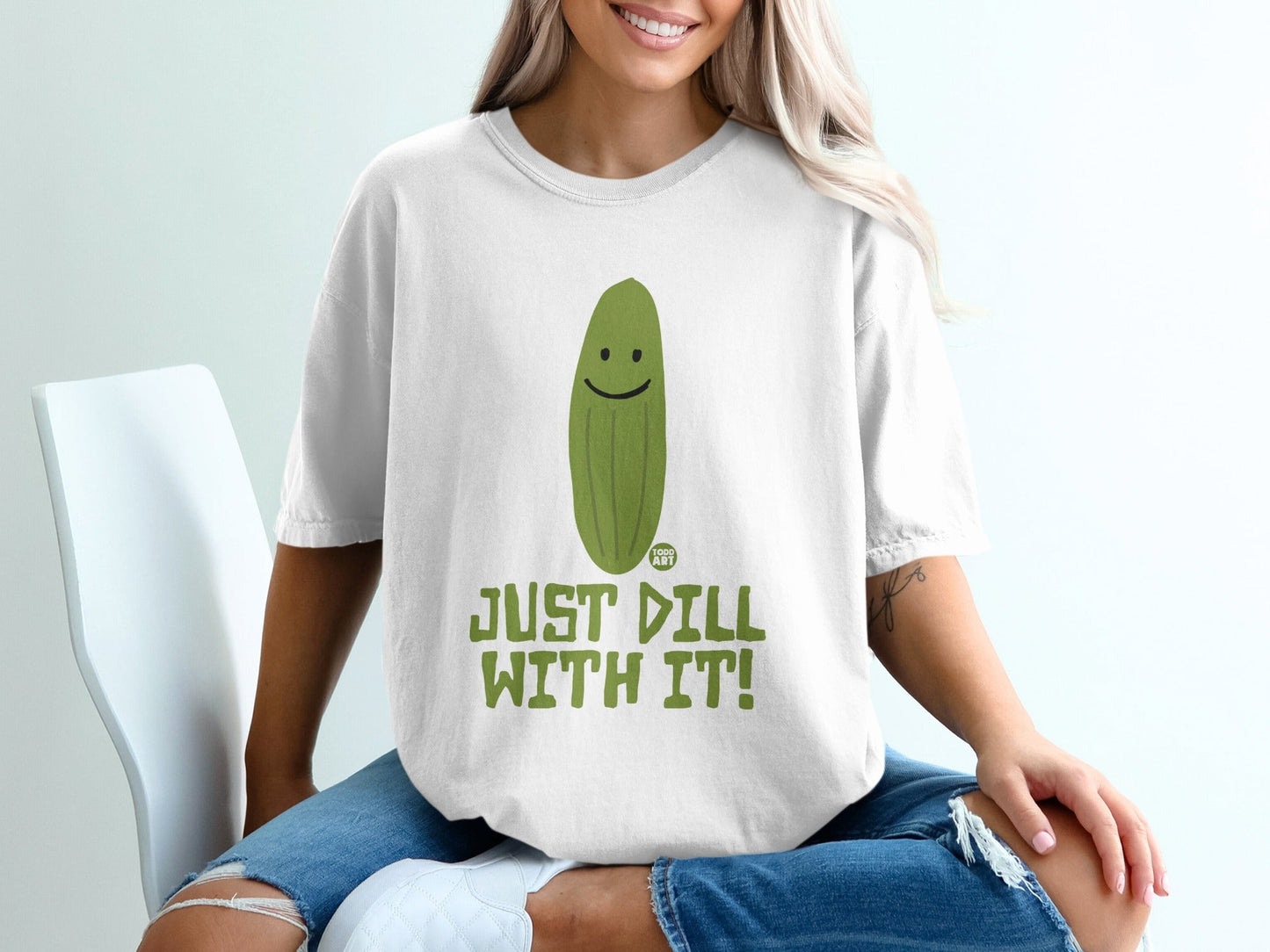 White t-shirt with a smiling pickle and "Just Dill With It!" text.